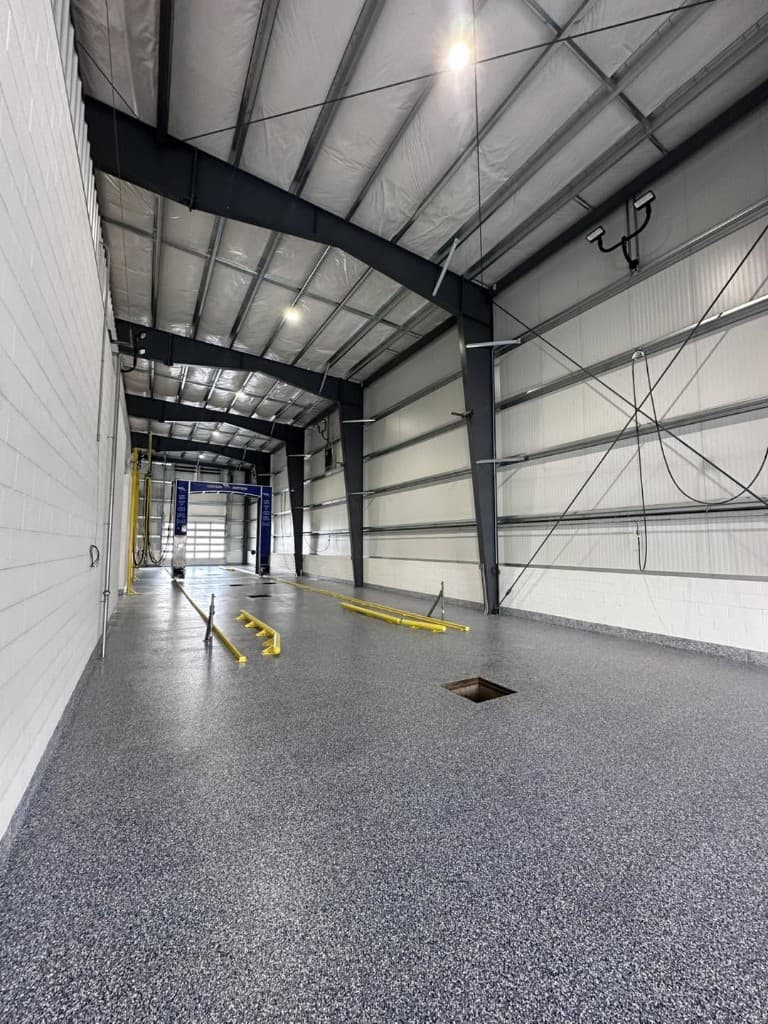 Industrial warehouse-style floor with a tough gray flake epoxy coating