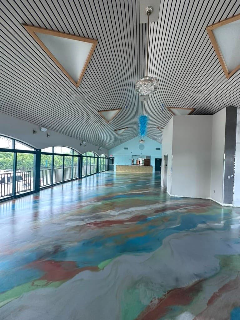 Colorful metallic floor in a bright event hall with big windows — Central New York