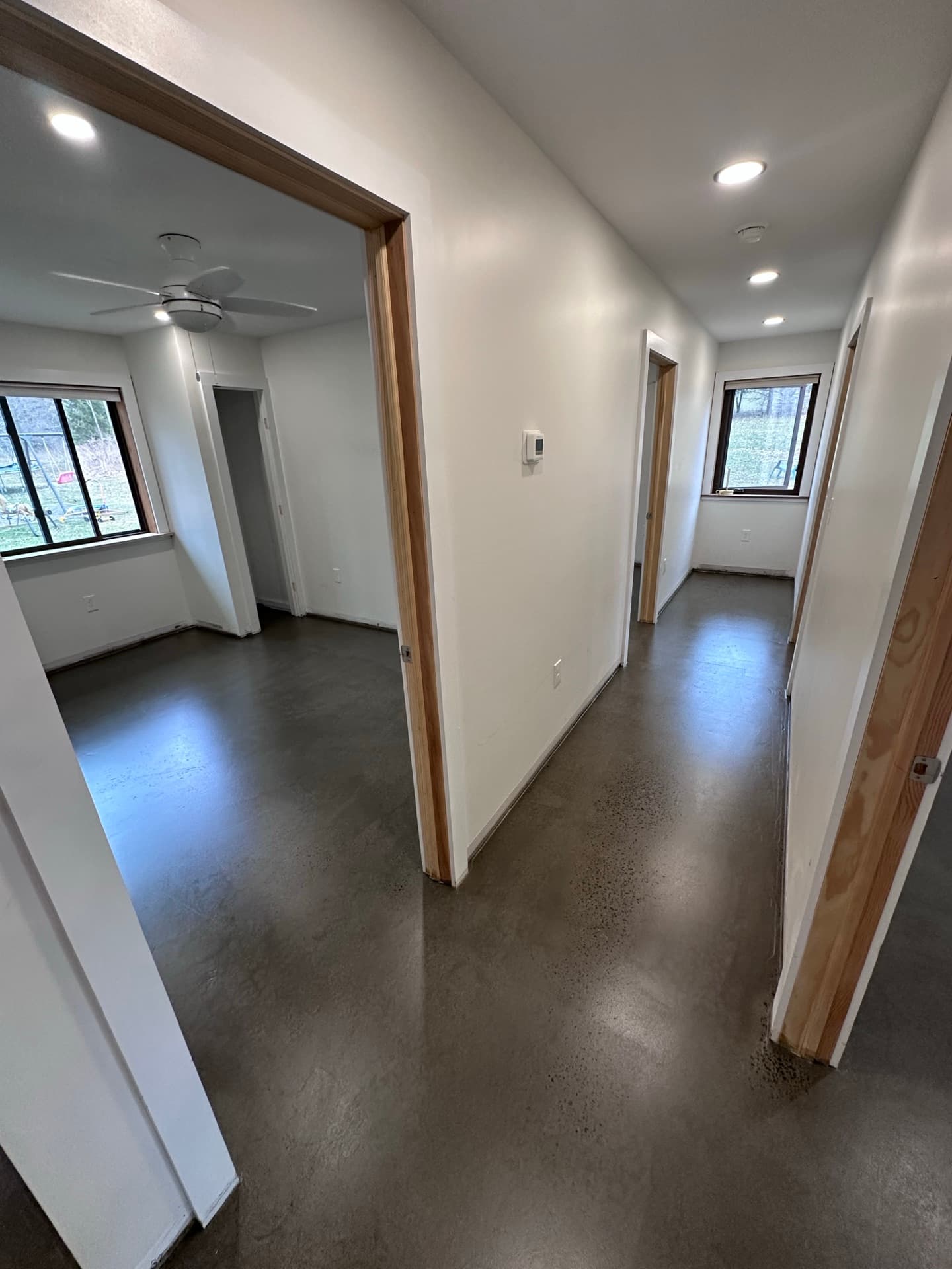 Dyed and sealed gray concrete floor in a finished interior — Central New York